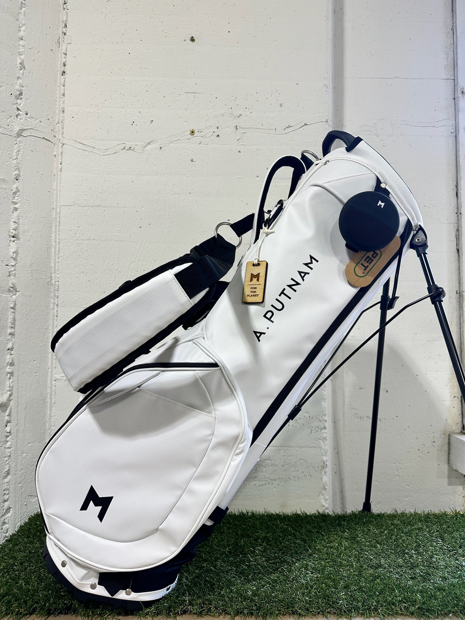 A. Putnam hand painted on the white MR1 sustainable golf bag. 