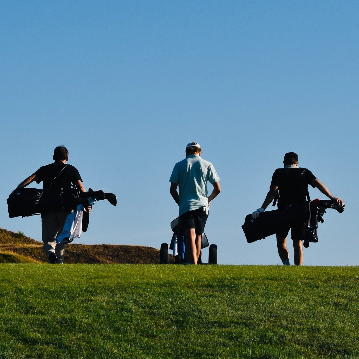 Group golf photo of team walking the Chambers Bay golf course.