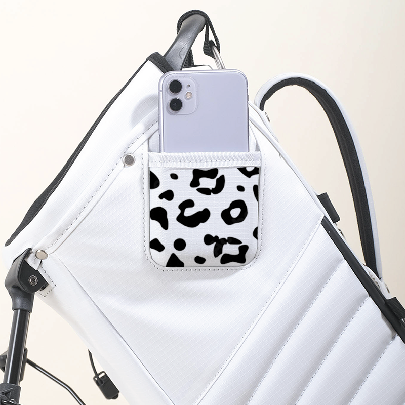 Artist Axel Lony designed contrasting black leopard print on MNML GOLF's 100% recycled MR1 golf bag.