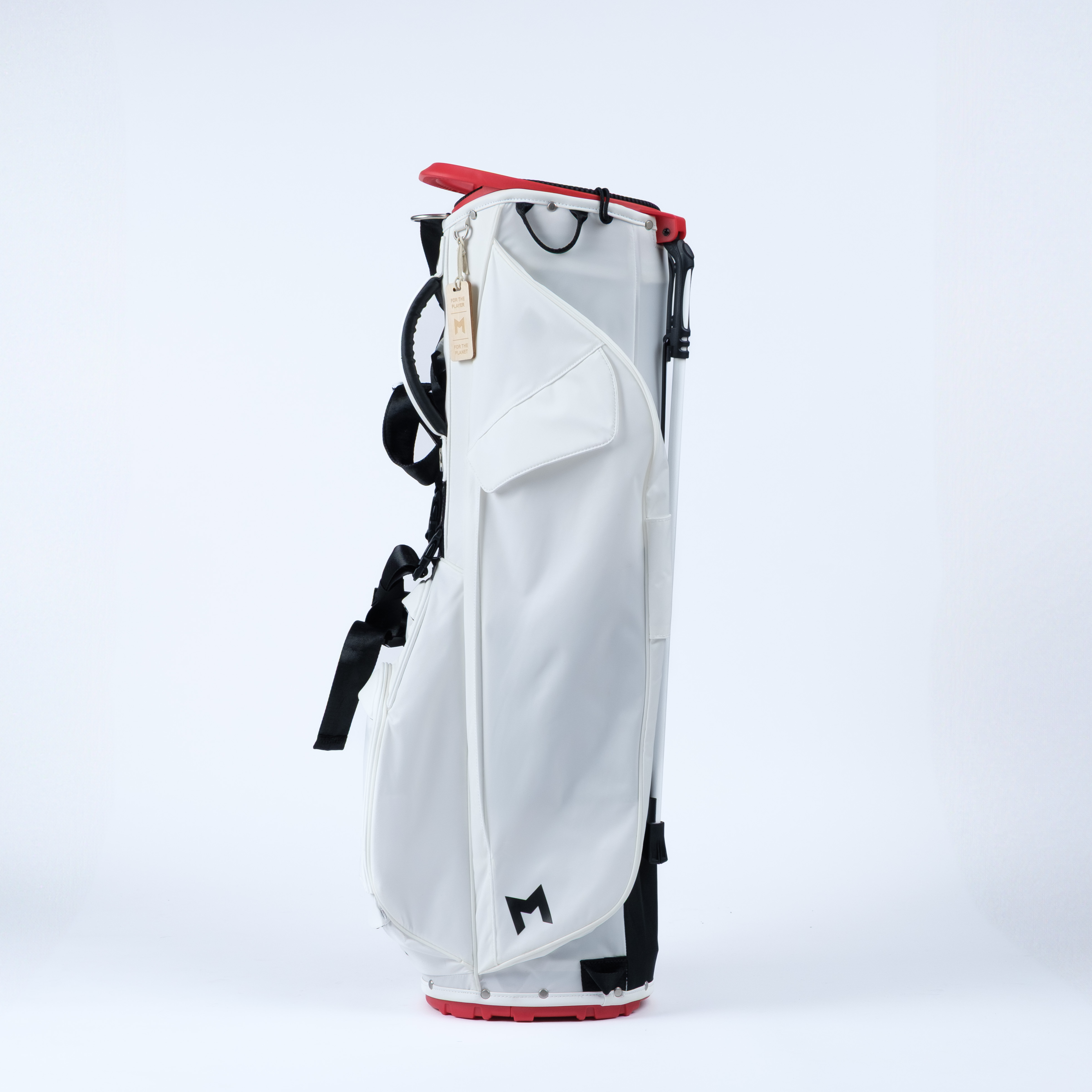 White golf bag with black accents and a red top on a white background