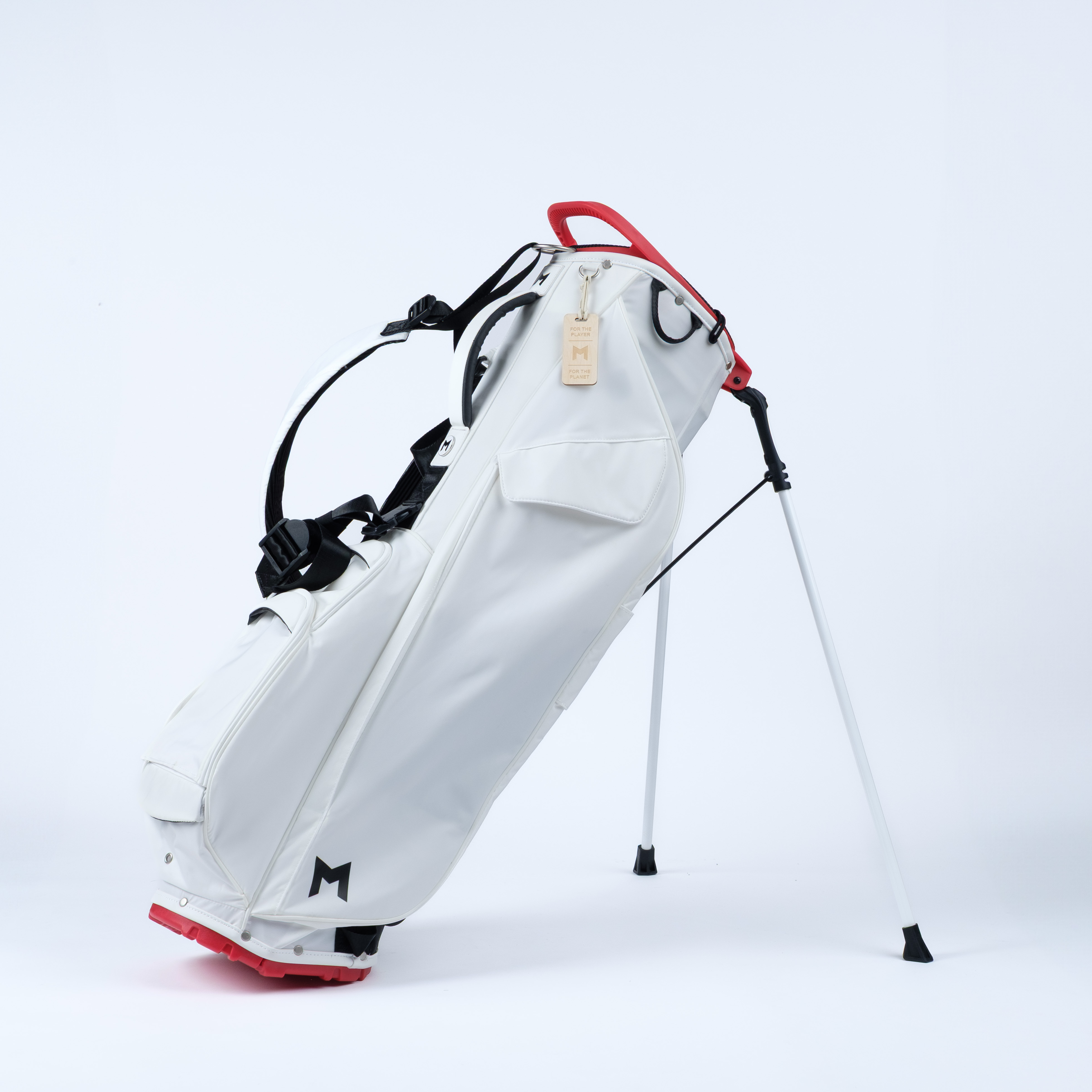 White golf bag with red accents on a white background