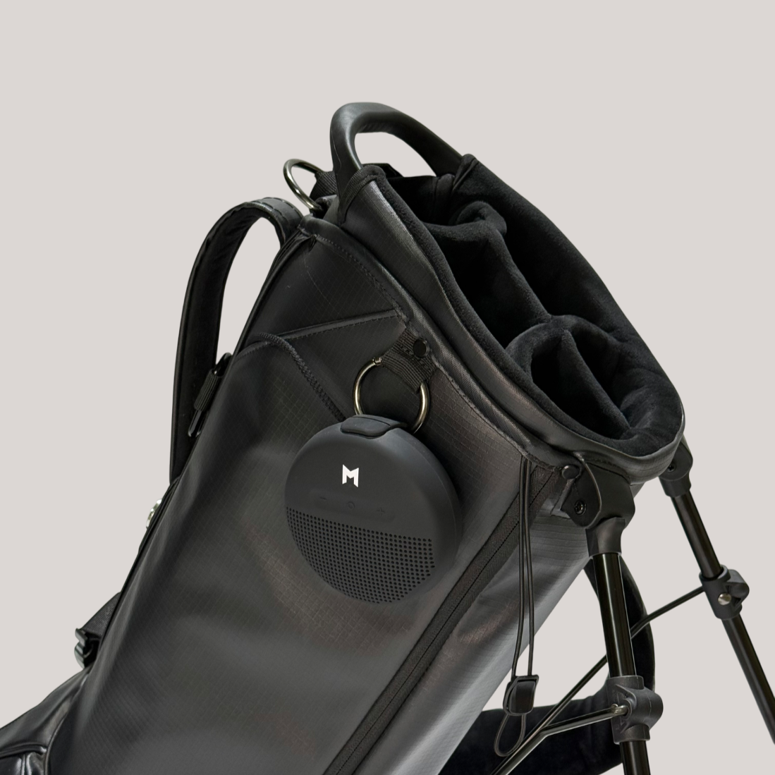 Durable high quality black golf bag showing 5 way divider system for easy organization and bluetooth speaker add on