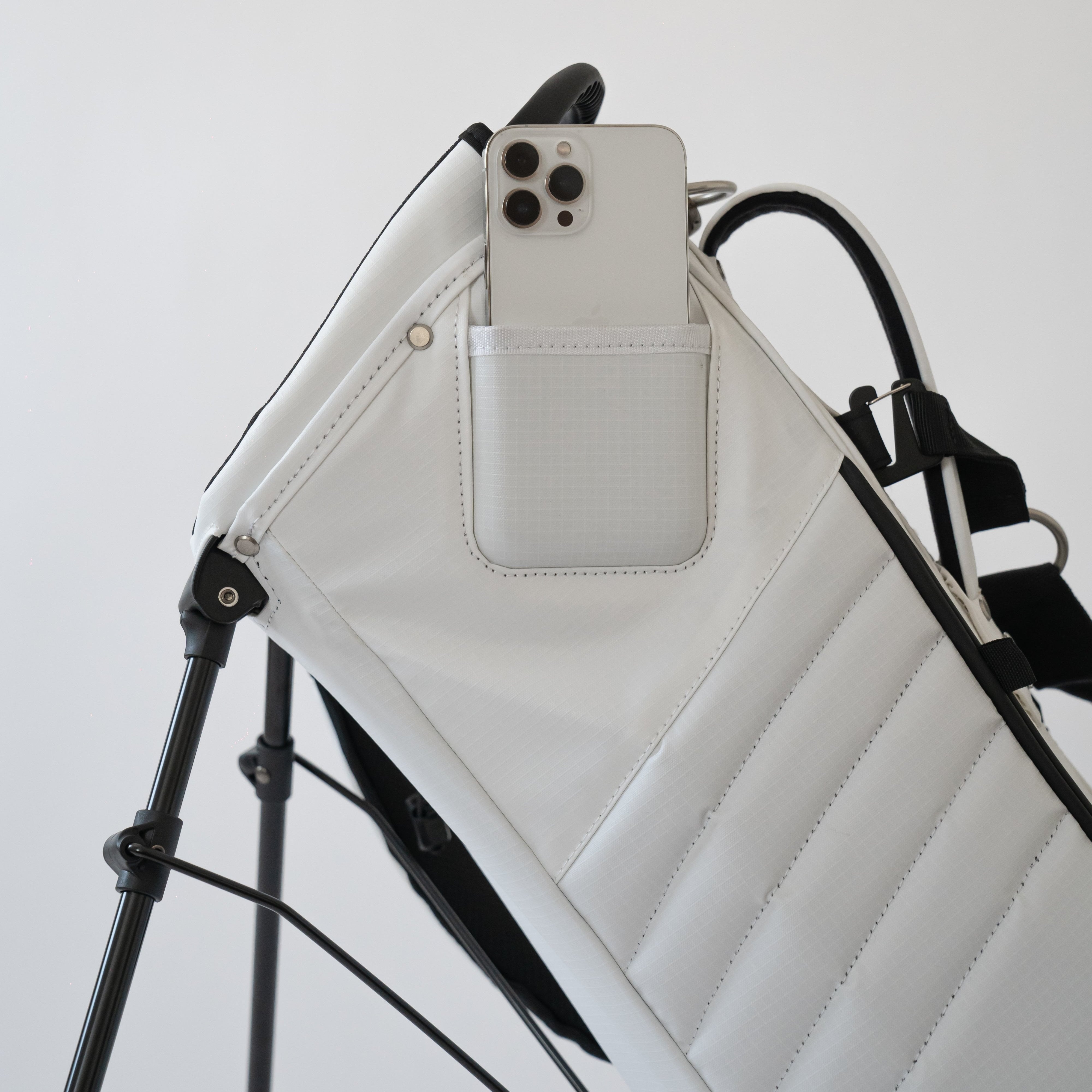 Filming pocket on MNML GOLF white stand bag to record your swing hands free