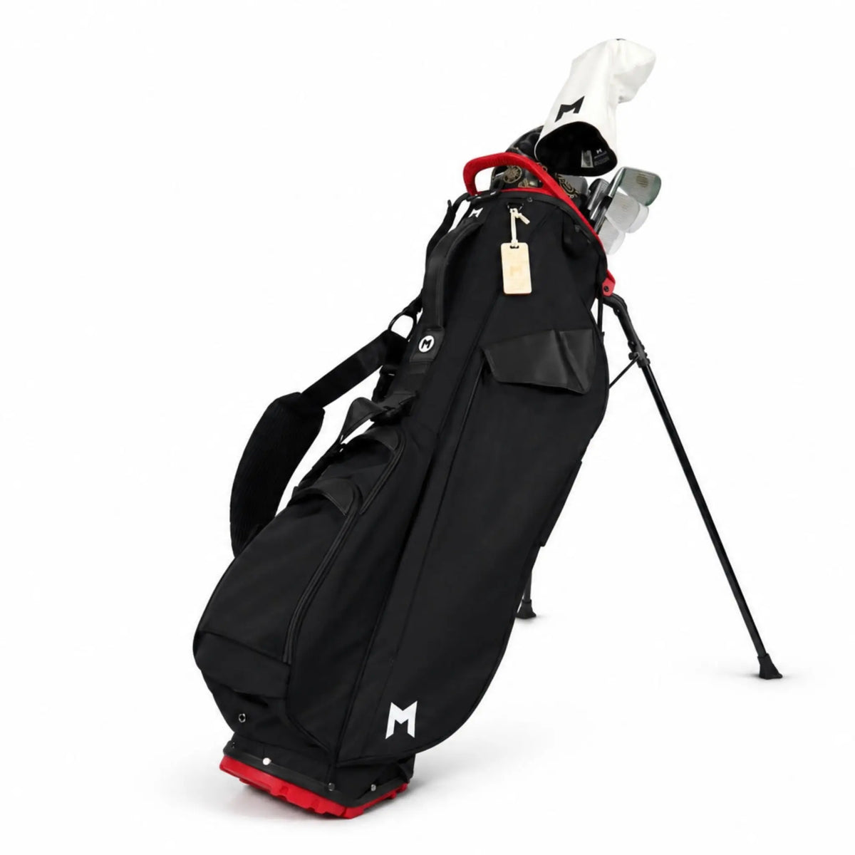 A black golf stand bag with red accents and a white golf club, shown on a clean white background.