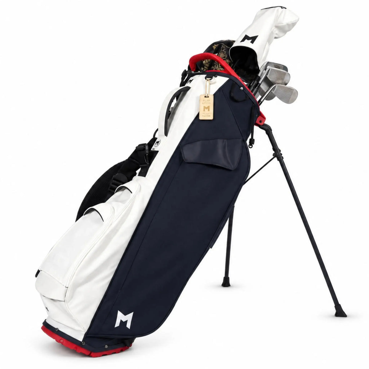 A stand golf bag in navy blue and white with red accents, containing golf clubs, shown on a clean white background.