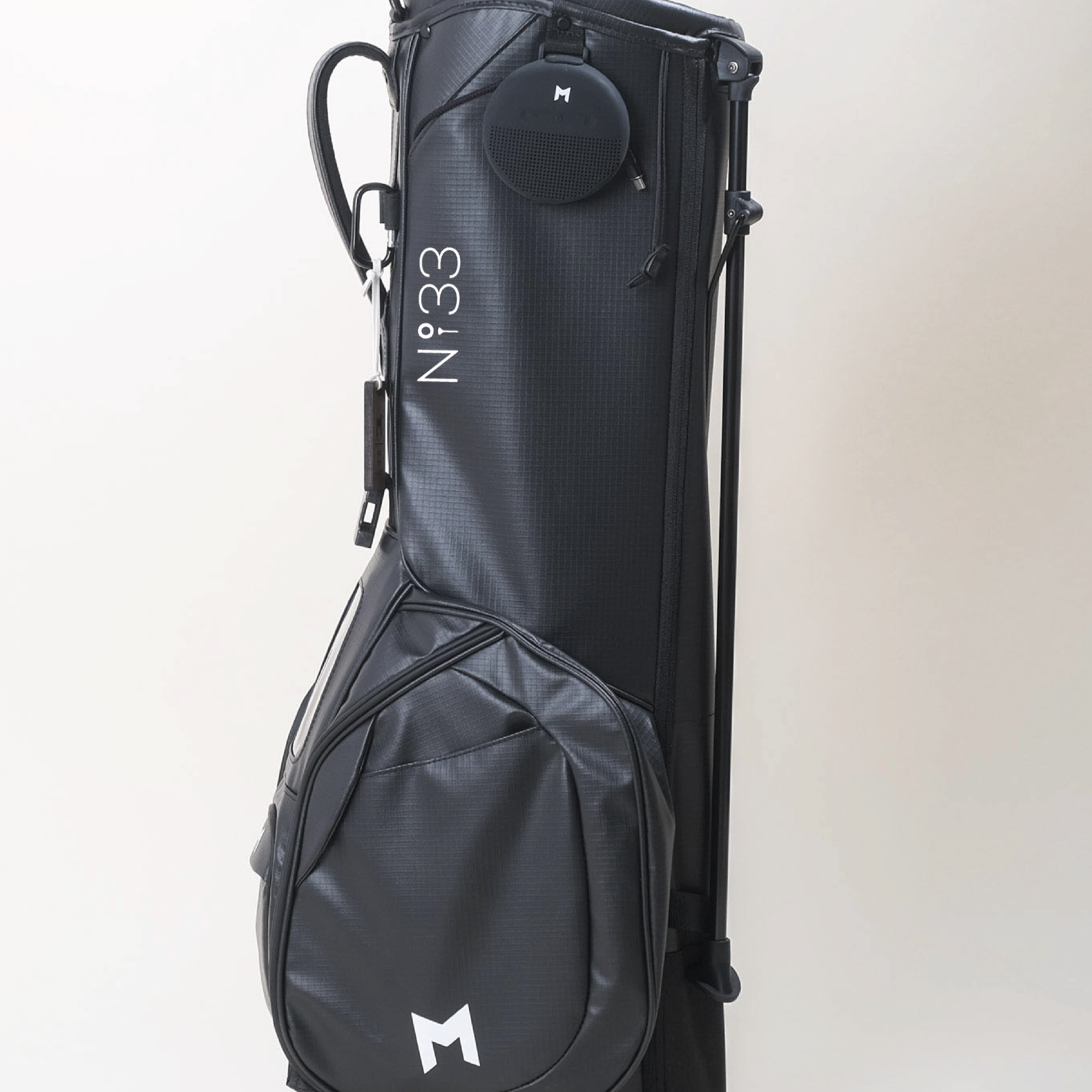 The MNML GOLF and The Number Thirty Three collaboration features the No33 golf logo.