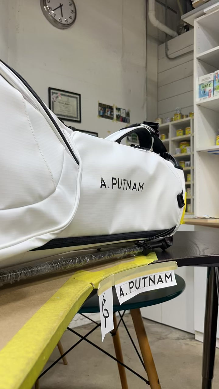This is a video of our certified artist hand painting the white MR1 eco golf bag in collaboration with A. Putnam.