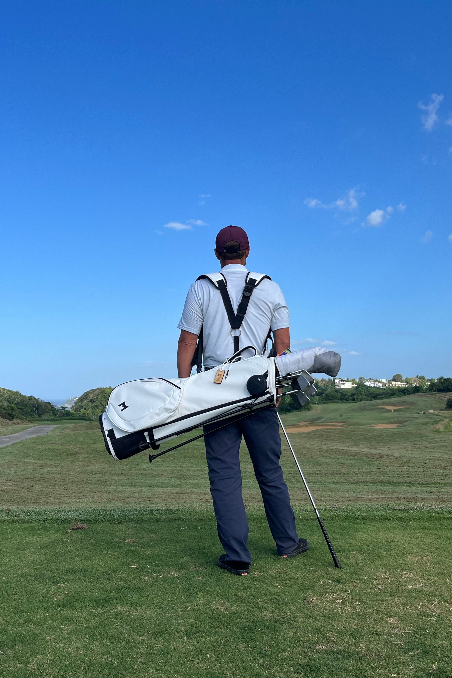 MNML GOLF founder Sam Goulden carrying MNML GOLF BAG Sustainable Model MR1 at Royal Isabela golf club