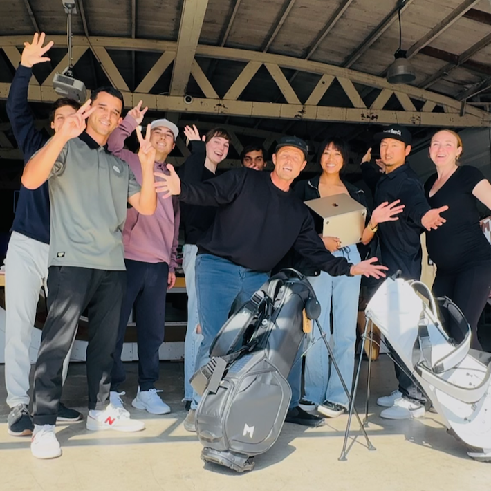 MNML GOLF Team at MNML GOLF CLUB in Redondo Beach California standing by the skate ramp waving hello