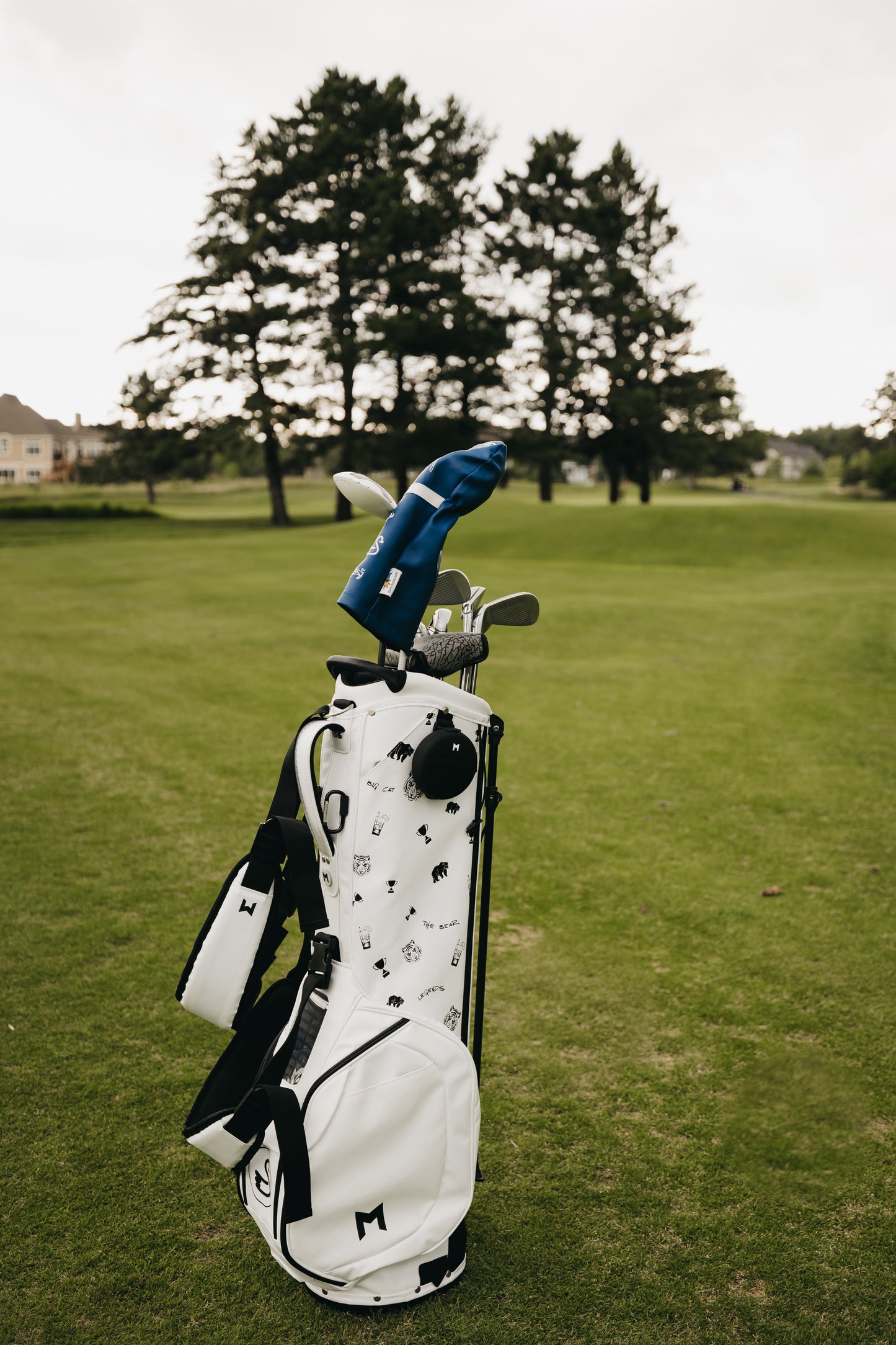 MNML GOLF and Swannies collaboration features MNML GOLF's white MV2 golf bag and Swannies company graphics.