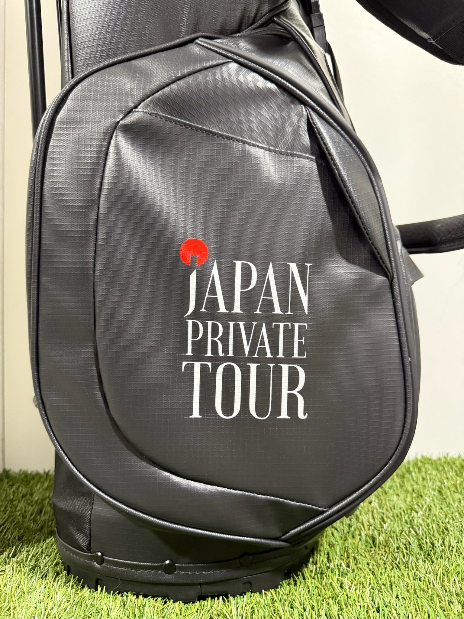 Hand painted custom Golf bag with 'Japan Private Tour' text on a grassy background