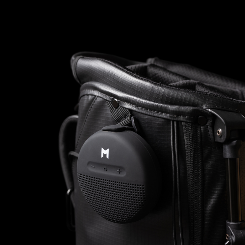 MNML GOLF's sustainable black golf bag with added on waterproof bluetooth speaker with 8hr battery life.
