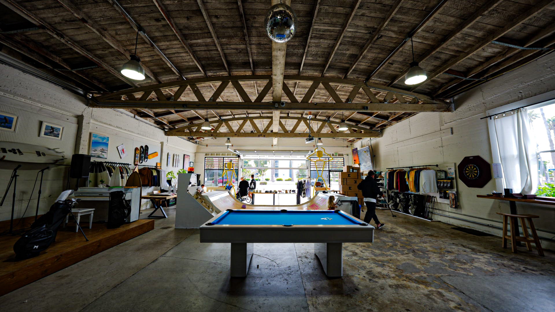 Inside look at the pool table, skate ramp, and event space of MNML GOLF Club, in Redondo Beach, California.