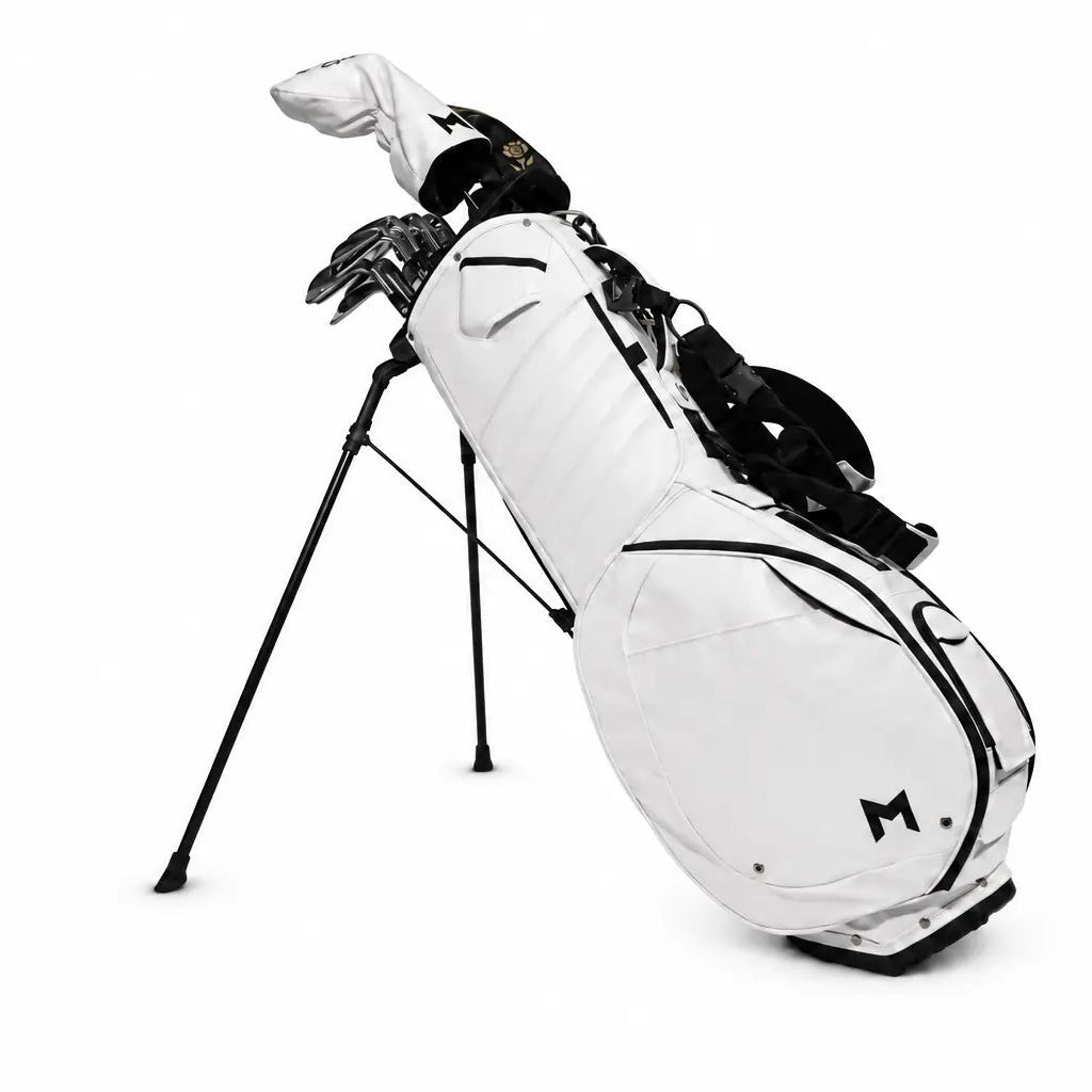 A white stand bag golf bag with black accents and golf clubs inside, shown on a clean white background.