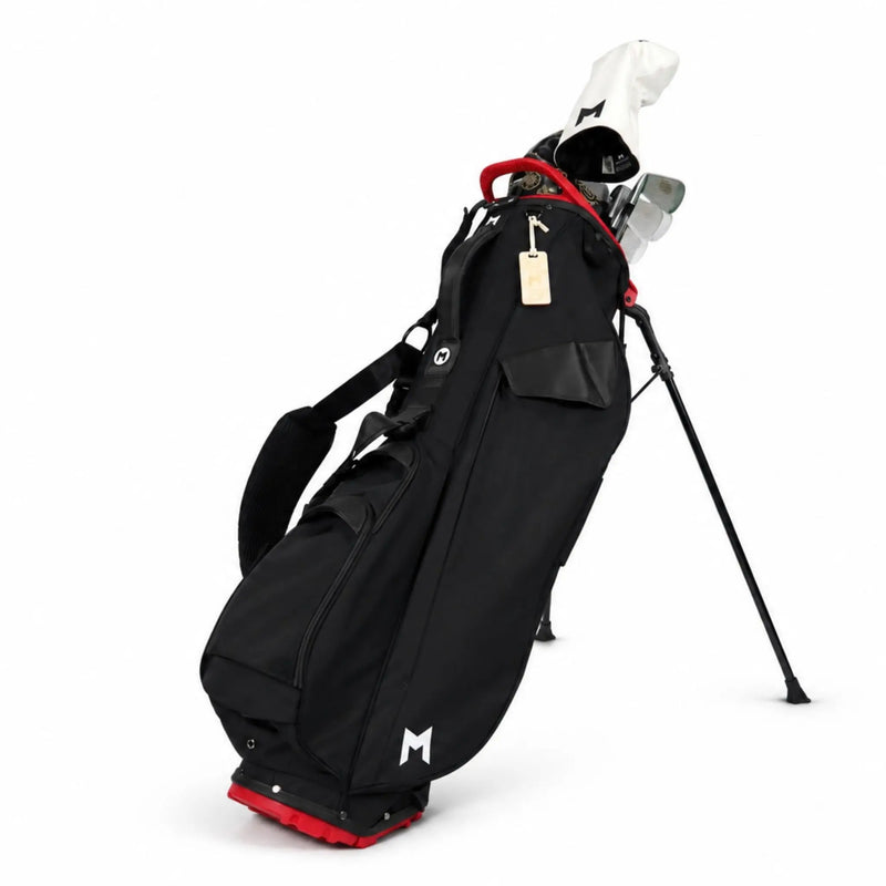 A black golf stand bag with red accents and a white golf club, shown on a clean white background.
