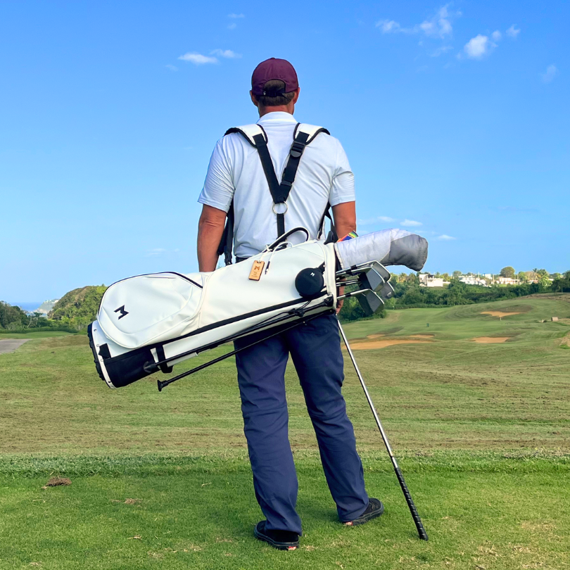 MNML GOLF's founder, Sam Goulden, carrying the white MR1 custom golf bag at Royal Isabela in Puerto Rico.