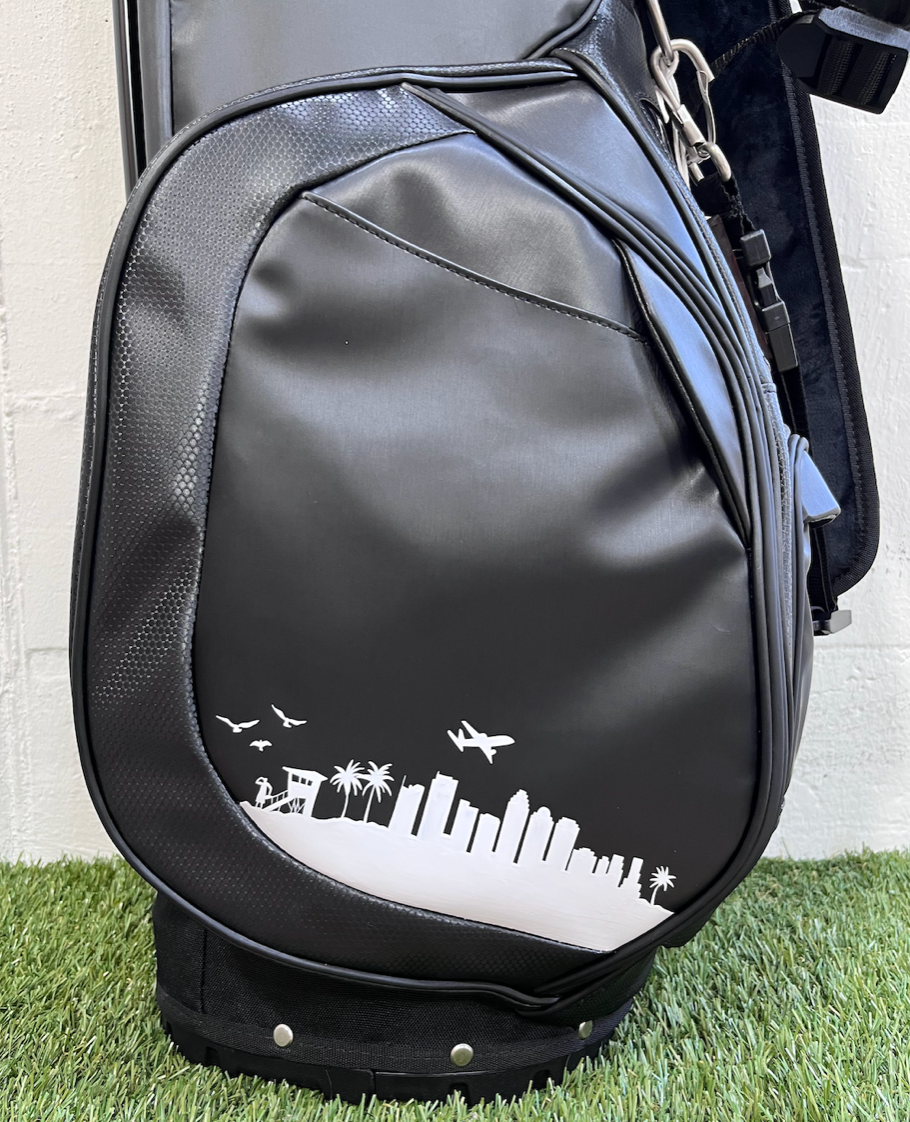 Black MNML GOLF bag with Los Angeles skyline hand painted in white. 