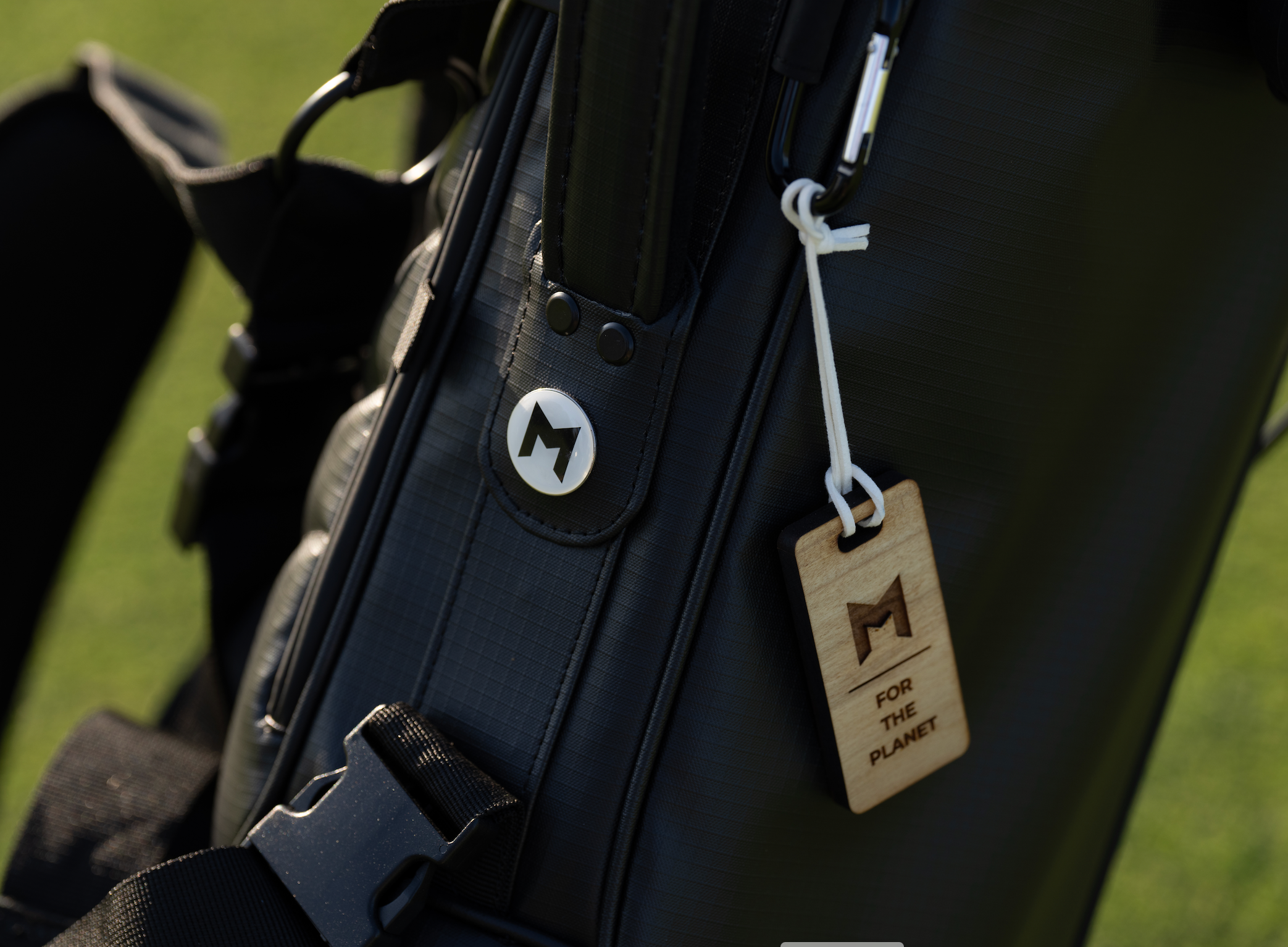 the mnml golf mr1 eco golf bag is made from recycled material and is available in black or white