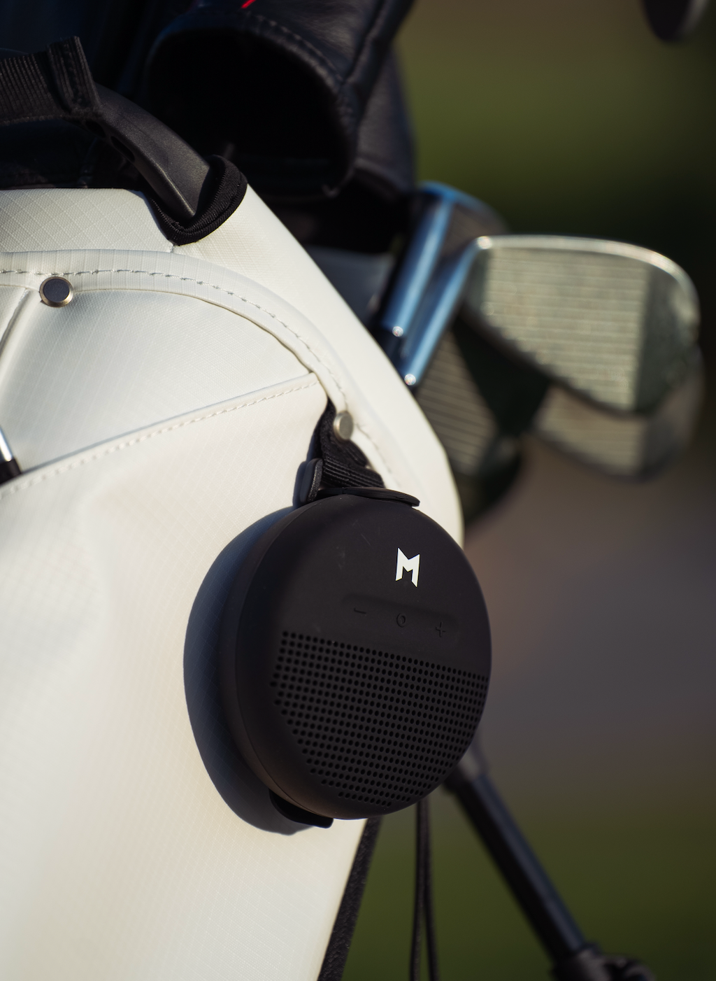 this is the mr1 recycled material golf bag, in white, with our bluetooth speaker displayed.
