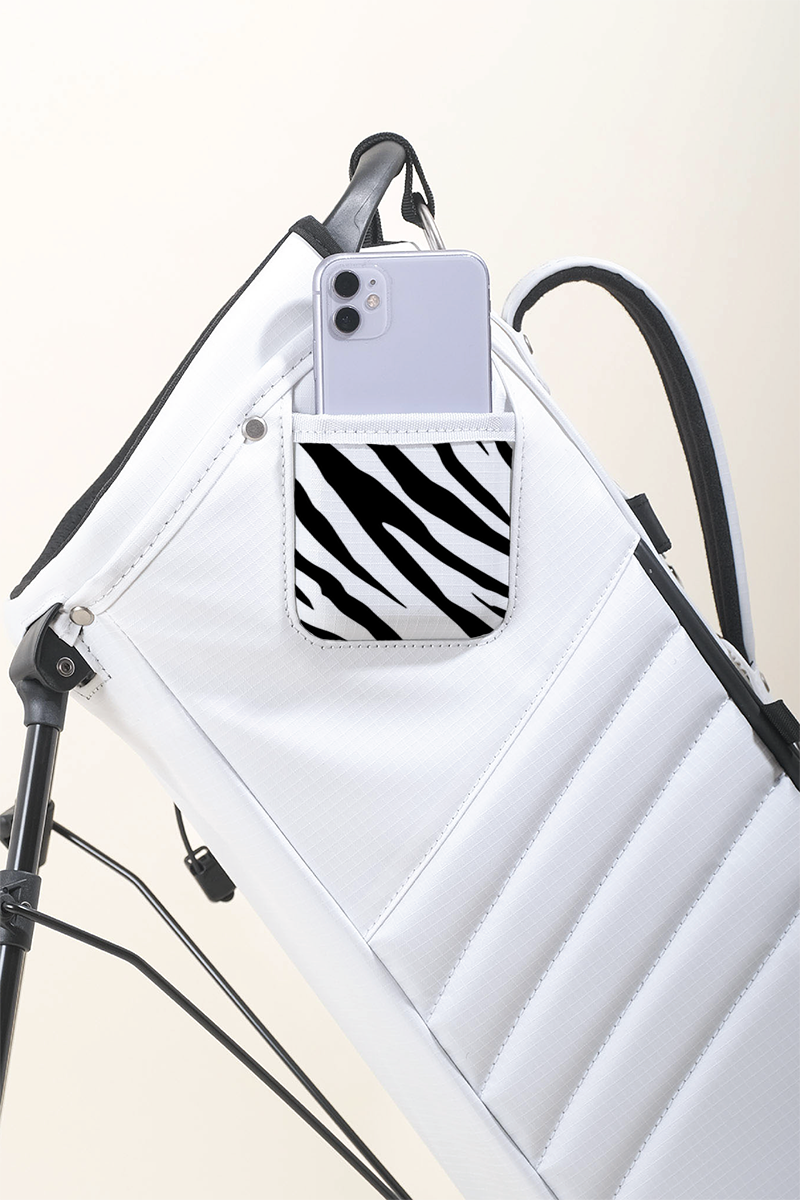 MNML GOLF collaborated with artist, Axel Lony, to hand paint a zebra print on a bright white MR1 bag.
