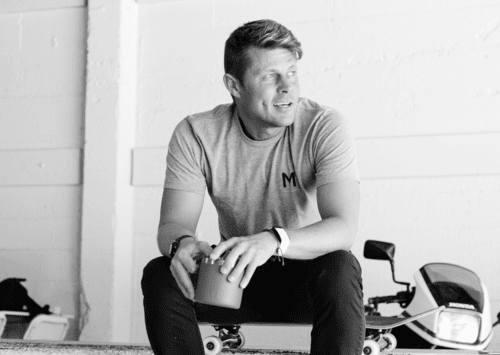 Founder of MNML GOLF, Sam Goulden, enjoying a cup of coffee on the MNML GOLF CLUB skate ramp, during an interview and photo shoot.