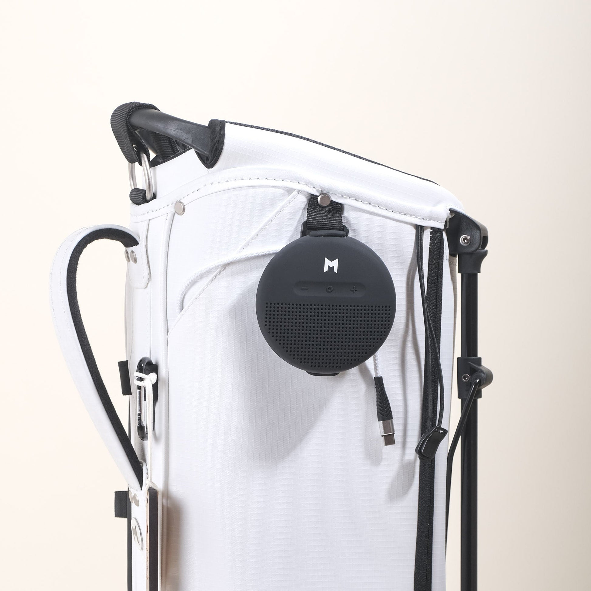 MNML GOLF's MR1 sustainable golf bag featuring waterproof bluetooth speaker with 8hr battery life to play your songs on the golf course or driving range