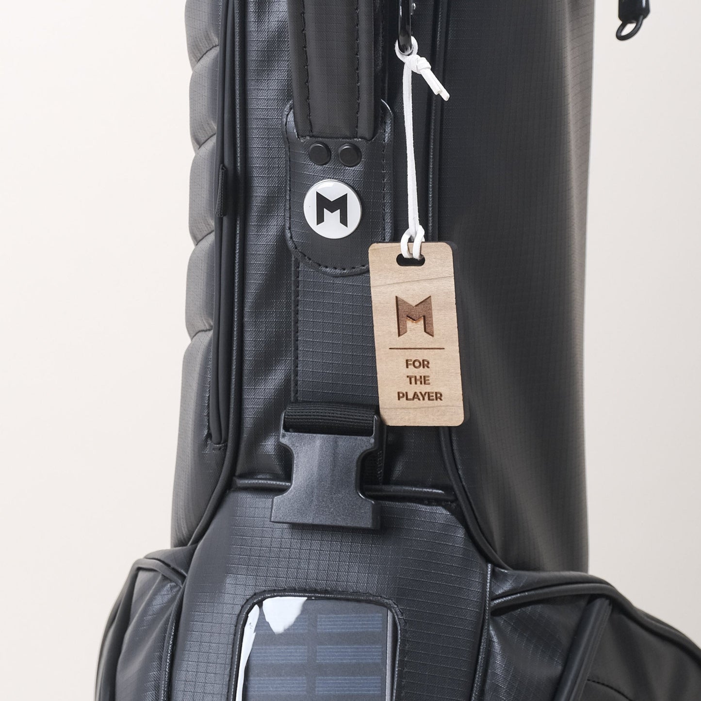 The black MNML GOLF MR1 bag is made from 100% recycled ripstop and features all magnetic pockets; available for purchase through MNML GOLF's Trade It Forward program.
