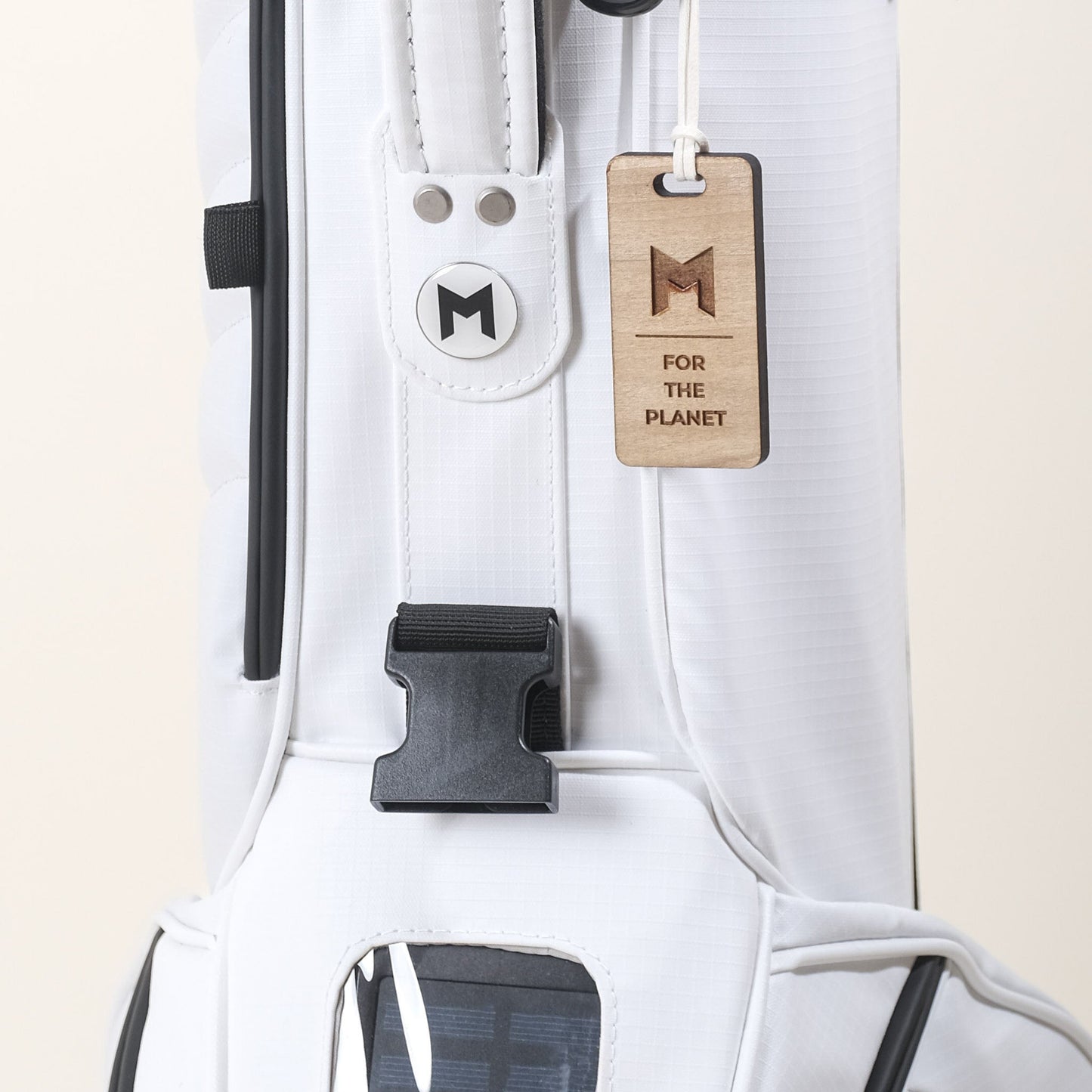 MNML GOLF's new MR1 sustainable golf bag comes in black and white and comes with a magnetic ball marker.