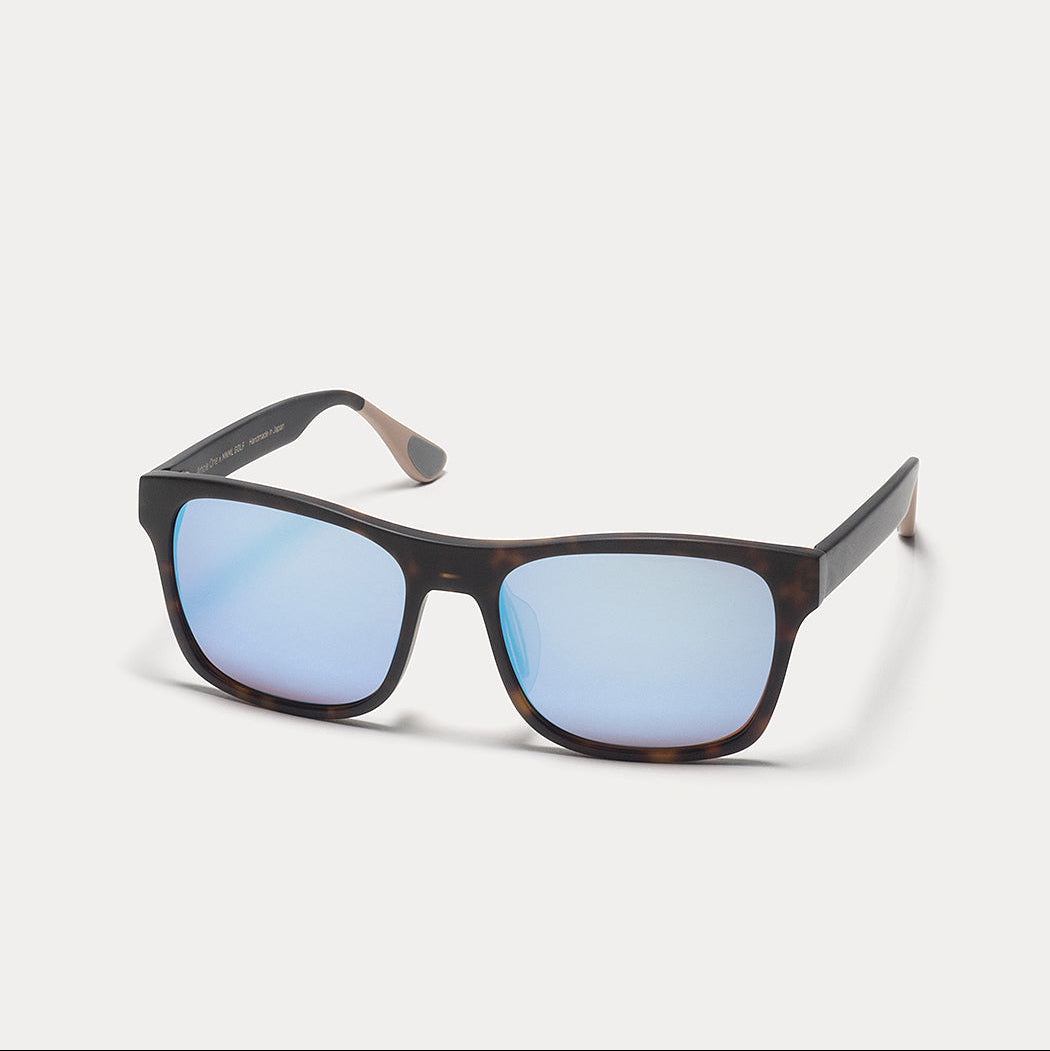 A pair of square-frame sunglasses with a dark brown tortoiseshell pattern and light blue mirrored lenses, shown on a light gray background.