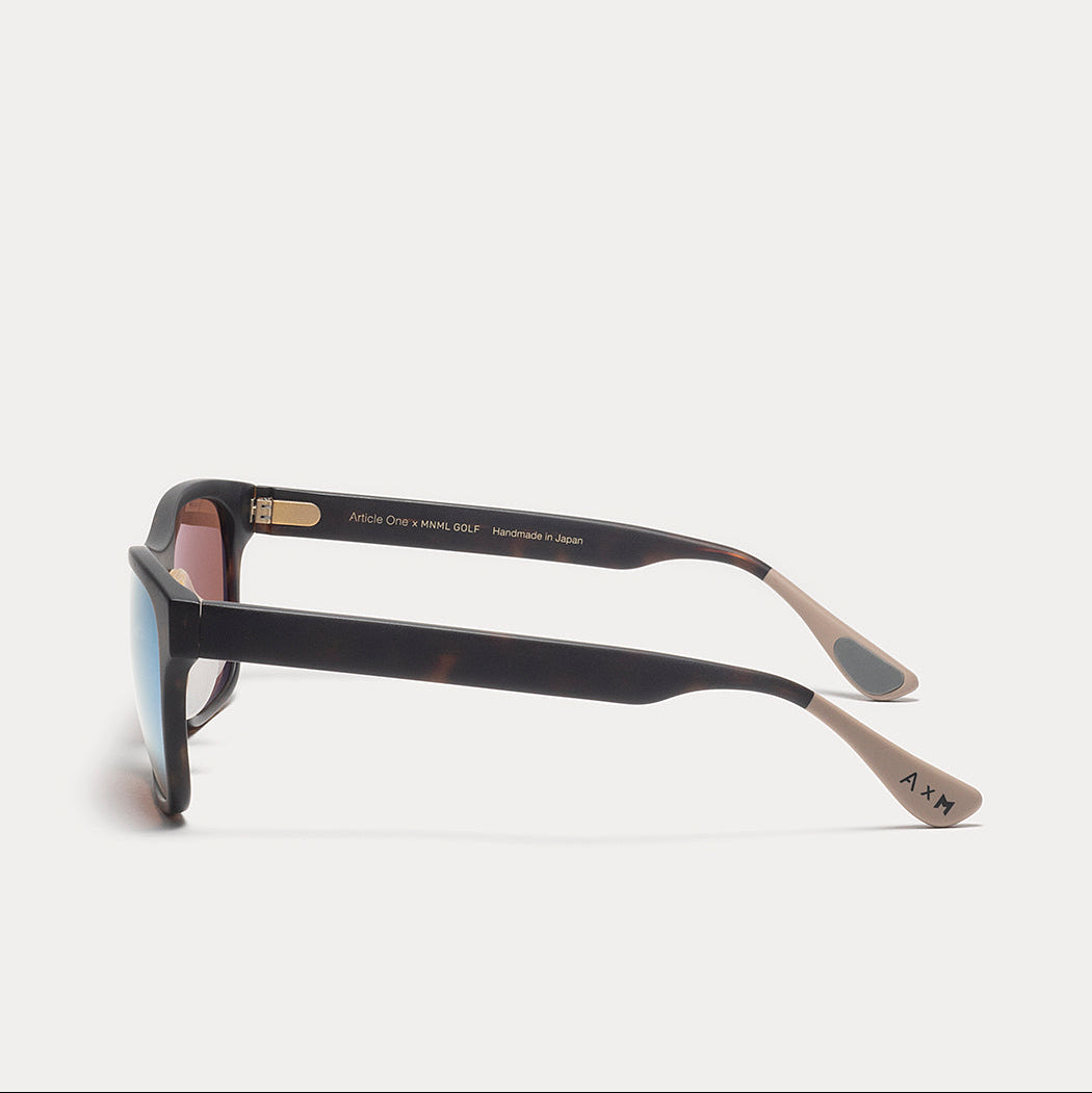 Black sunglasses with gold accents on a white background