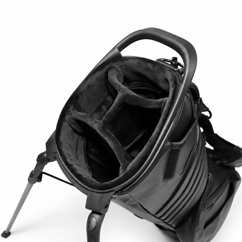 A black stand-up golf bag with a padded interior and leg support, photographed on a clean white background.