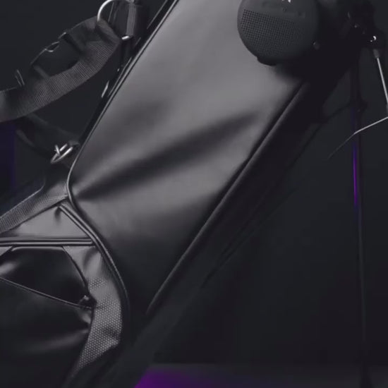 Video of MNML GOLF's MV2 golf bag in black with magnetic pockets and phone pocket for filming. 