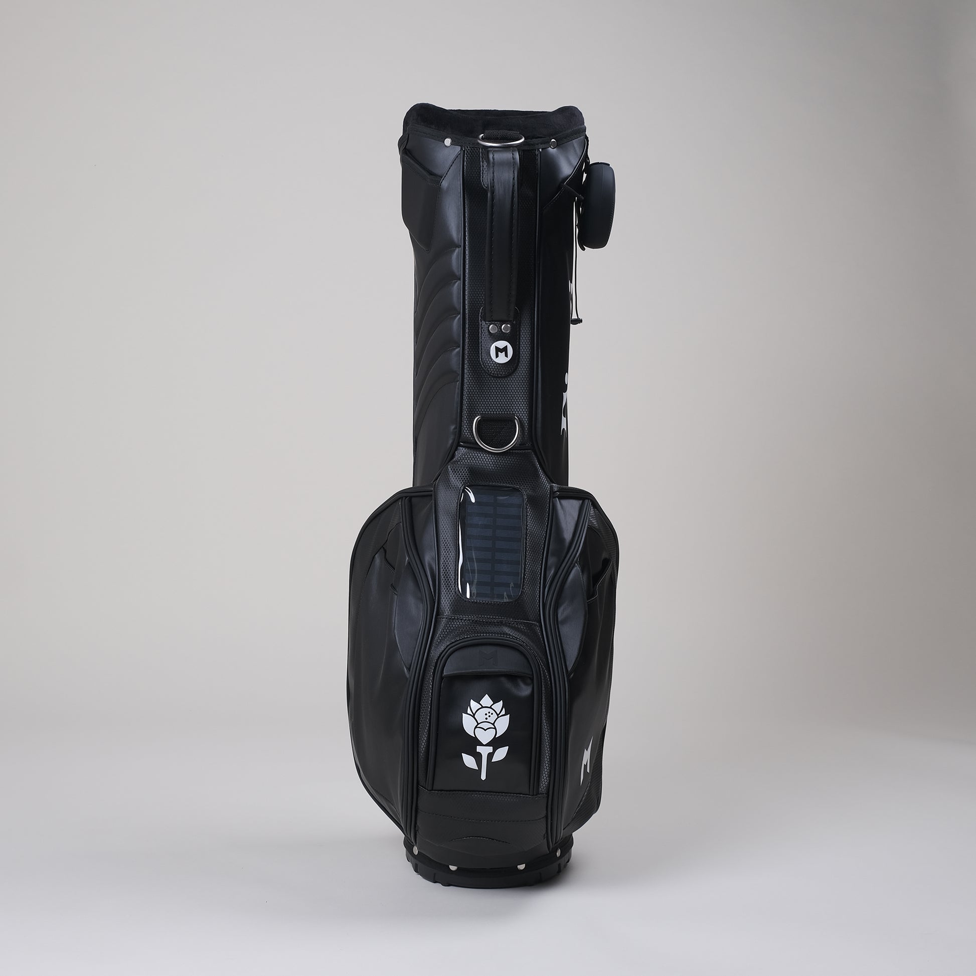 Black MNML GOLF bag with Fiori logo hand painted on magnetic ball pocket displayed. 
